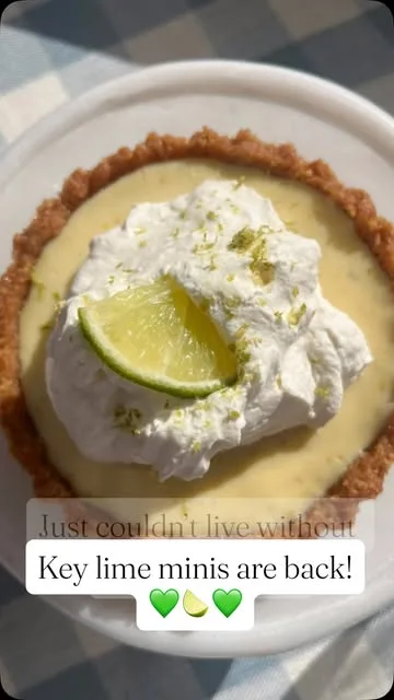 Key lime mini pie with whipped cream and lime zest